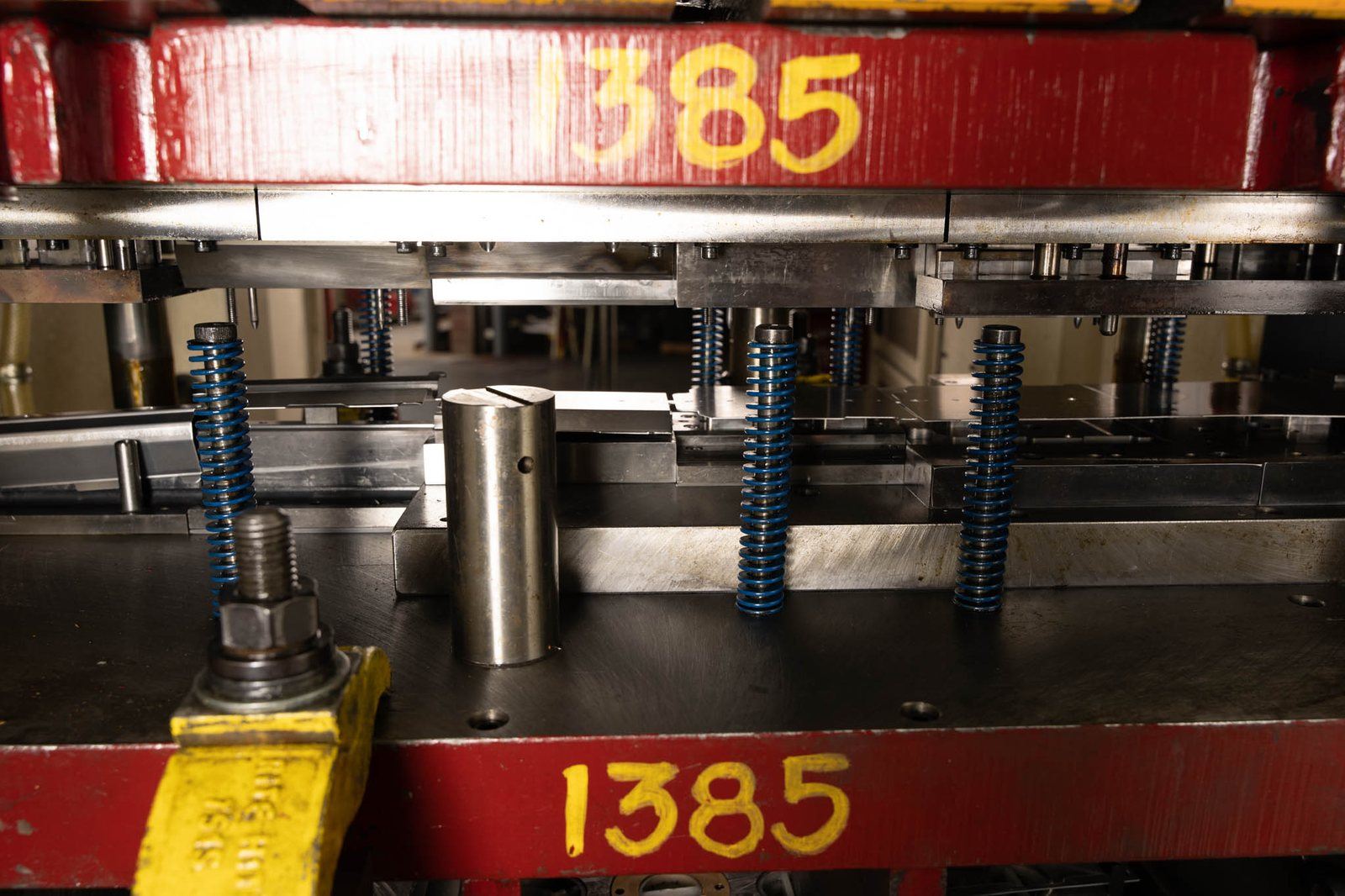 A progressive die mounted in a press