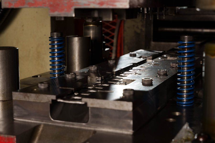 An open die showing the punches and the die block