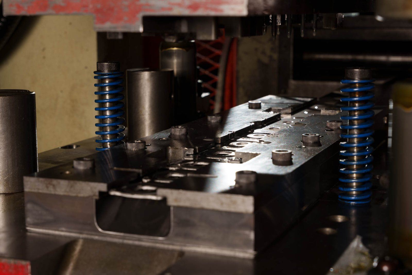 An open die showing the punches and the die block
