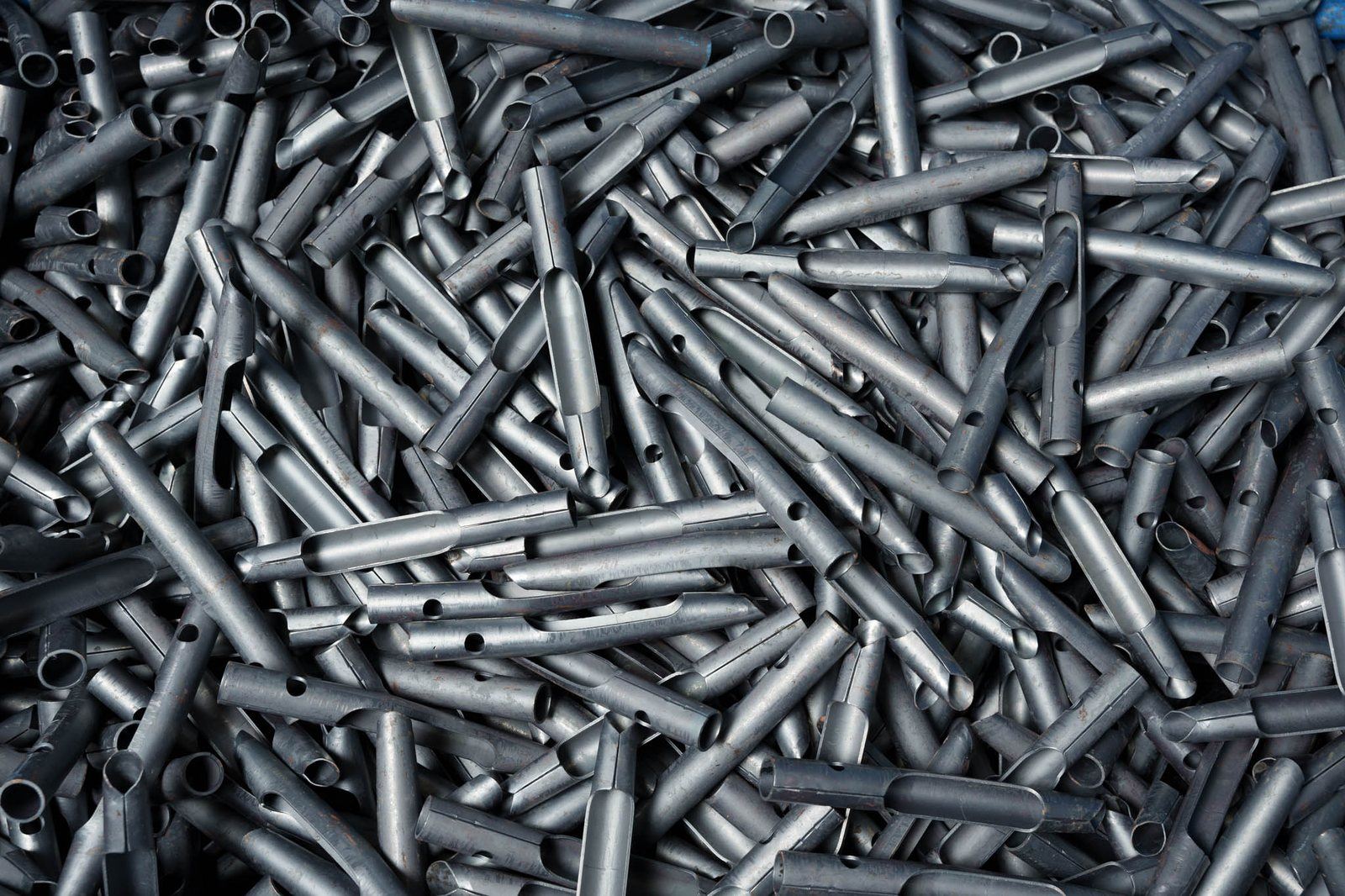 Formed tubular stampings in bulk